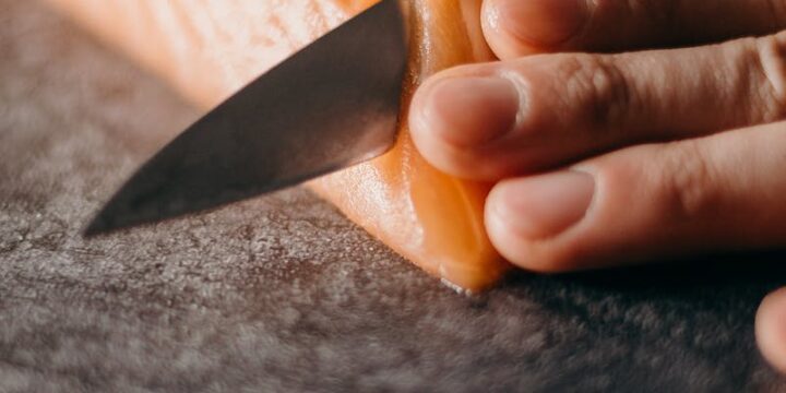 Photo Of Person Slicing Salmon