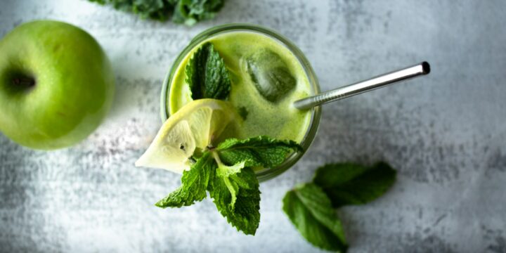 green lime fruit on white textile