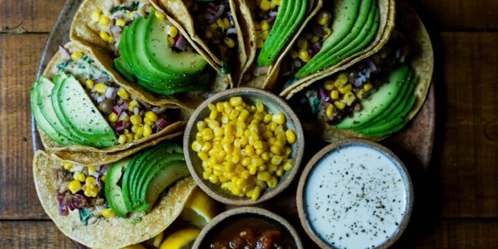 assorted tacos on wooden plate