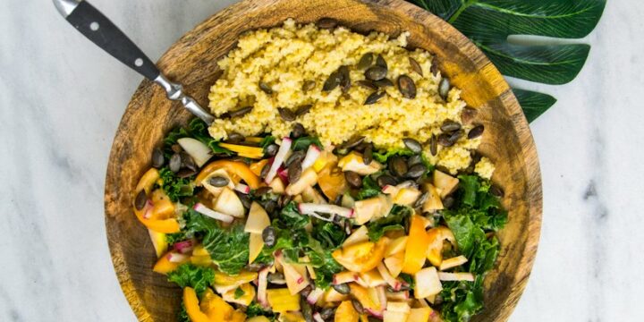 cooked rice with vegetable salad in brown wooden bowl