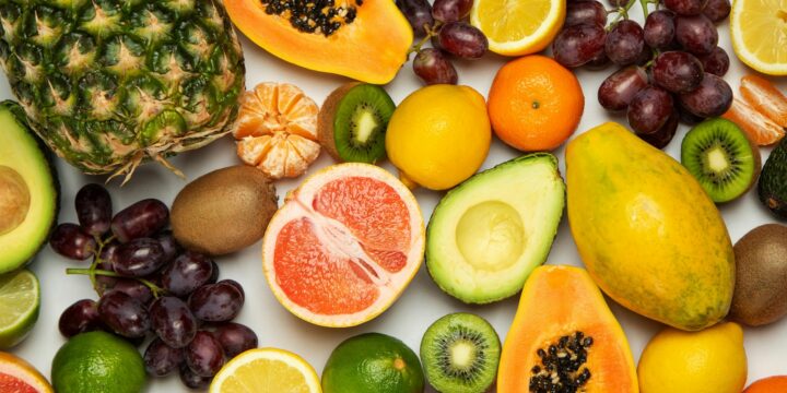 sliced orange fruit and green round fruits