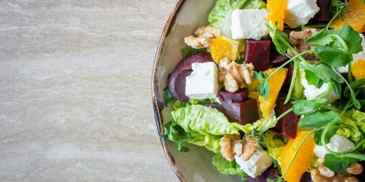 bowl of vegetable salad with walnuts